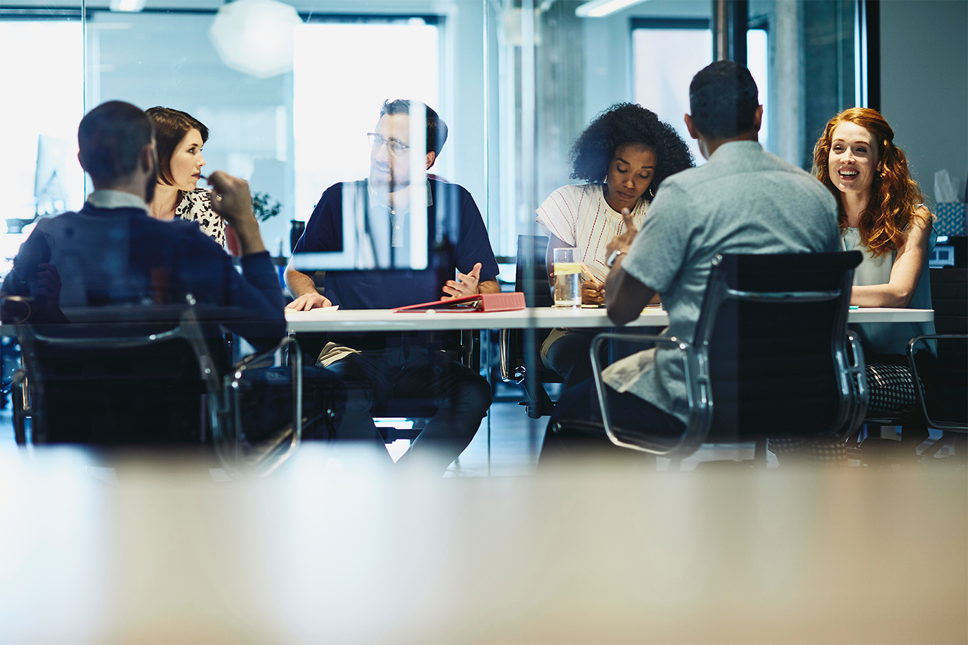 Education professionals collaborating around a meeting table